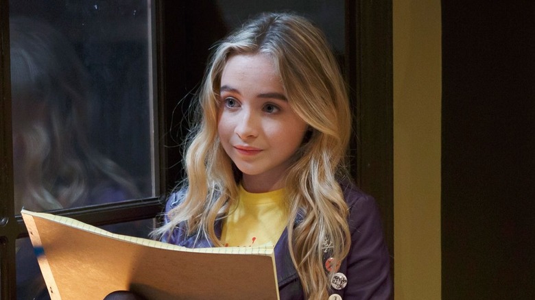 Maya holding a sketchbook looking concerned in Girl Meets World