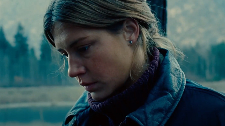 Adèle Exarchopoulos looking down with a forest in the background in the film the five devils