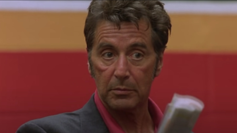 Al Pacino pointing with rolled up paper Any Given Sunday