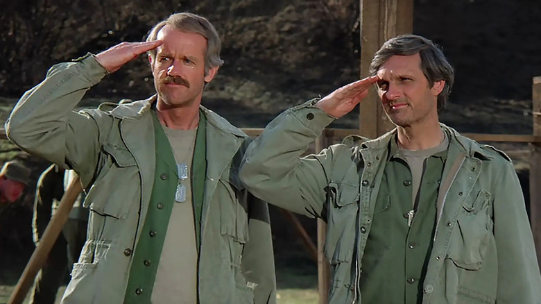 Mike Farrell and Alan Alda on M*A*S*H