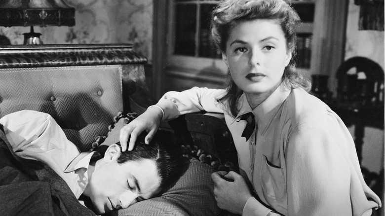 Ingrid Bergman sits over a sleepy Gregory Peck in Spellbound