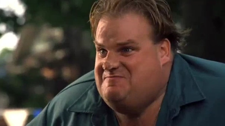 Chris Farley sitting in Dirty Work