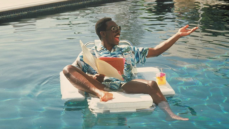 Eddie Murphy luxuriates in a pool as Axel Foley in Beverly Hills Cop II