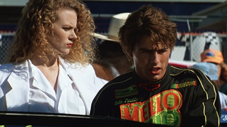 Nicole Kidman as Claire Lewicki watches Tom Cruise as Cole Trickle prepare to race in Days of Thunder