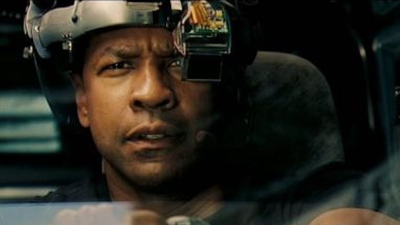 Denzel Washington as Doug Carlin dons a helmet in Deja Vu