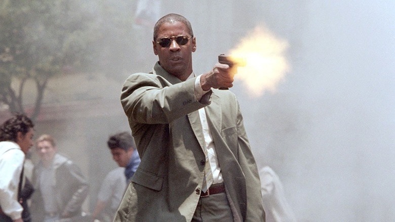 Denzel Washington fires off a pistol as Creasy in Man on Fire