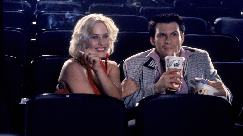 Patricia Arquette as Alabama takes in a movie with Christian Slater as Clarence in True Romance