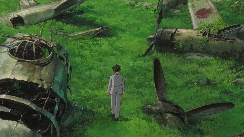 Jiro walks among the ruined nightmare of his dream of flight, in The Wind Rises