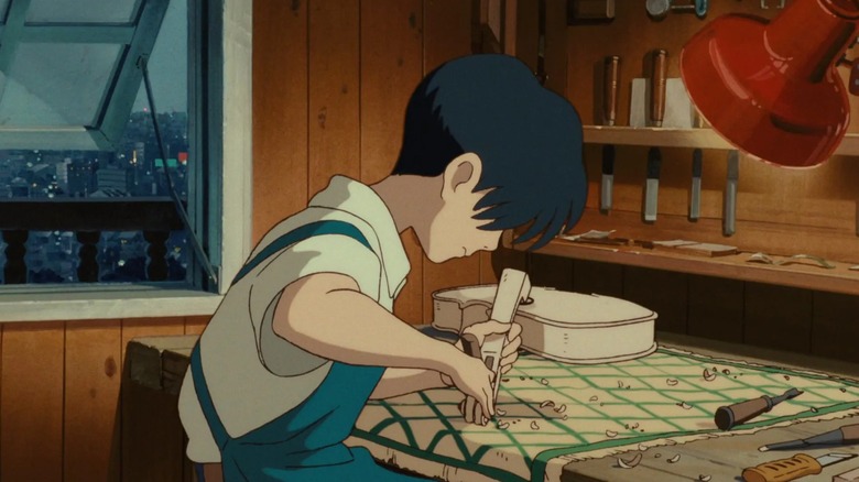 Seiji practices his instrument crafting skills on a violin in Whisper of the Heart