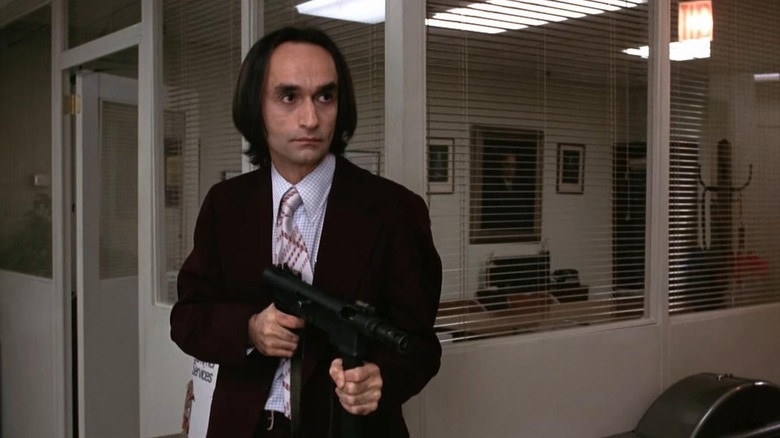 Sal, holding a machine gun in a bank in Dog Day Afternoon.