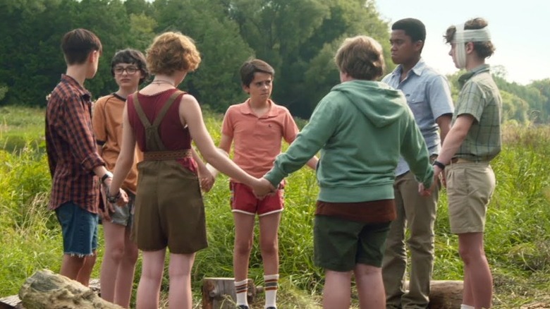 Losers Club holding hands in It