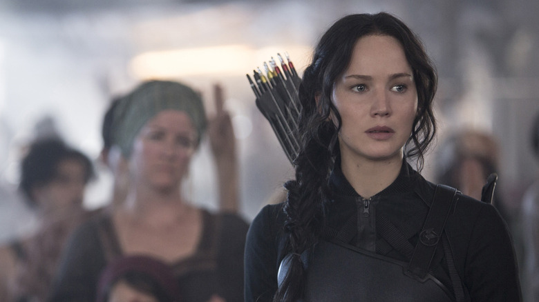 Jennifer Lawrence as Katniss Everdeen speaking for a crowd in The Hunger Games: Mockingjay - Part 1