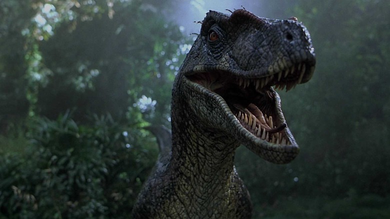 A raptor bearing its teeth in Jurassic Park III