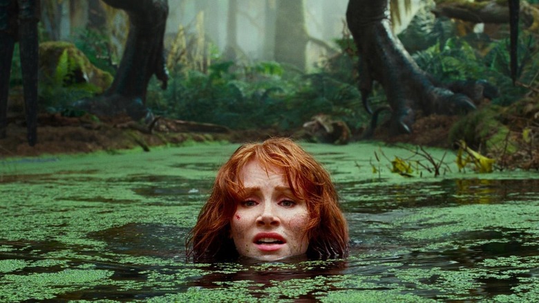 Bryce Dallas Howard's Claire hiding in the swamp in Jurassic World Dominion