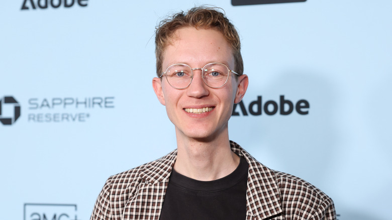 Director Charlie Shackleton smiles on the red carpet at the Sundance Film Festival