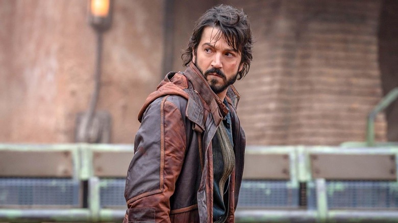 Diego Luna as Cassian looking over his shoulder in Andor season 1