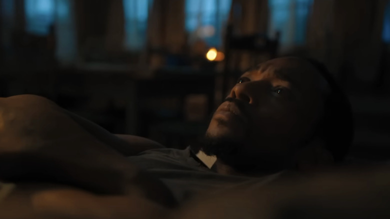 Anthony Mackie's Will lies down and looks reflective in Elevation