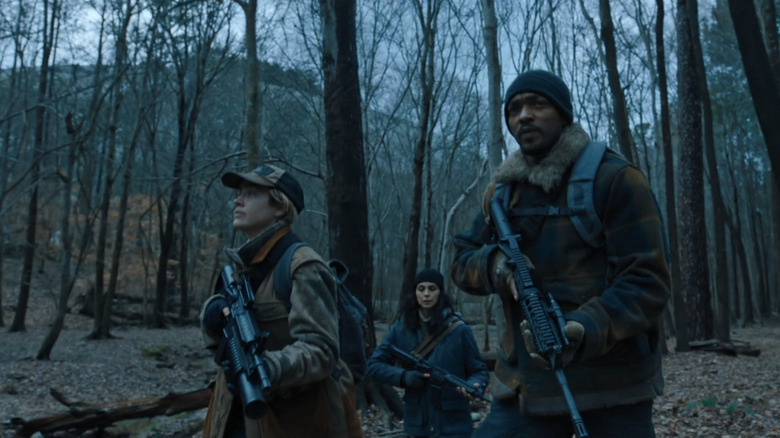 Anthony Mackie's Will, Morena Baccarin's Nina and  Maddie Hasson's Katie walk through the woods in Elevation