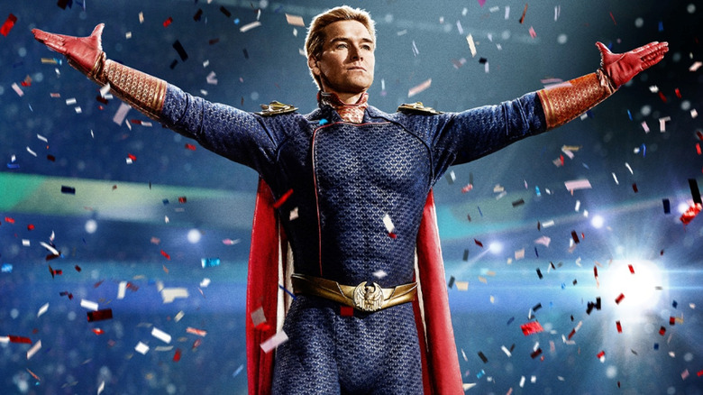 Antony Starr as Homelander with his arms raised and surrounded by confetti in a poster for The Boys season 4