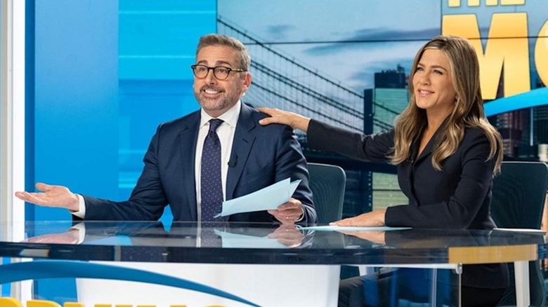 Steve Carrell in the role of Mitch Kissler and Jennifer Aniston in the role of Alex Levy all smiling in the morning show