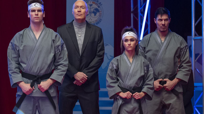 Terry Silver stands with team Iron Dragons in Cobra Kai