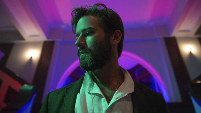 Armie Hammer as Steve Lift looks off camera in Sorry to Bother You