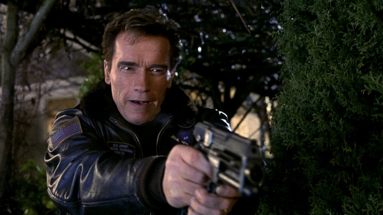 Adam Gibson Arnold Schwarzeneger smiles when he aims at the gun on the 6th day