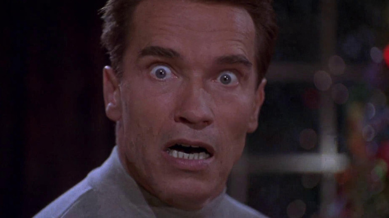 Arnold Schwarzenegger's Howard Langston looks shocked at forgetting a present in Jingle All the Way