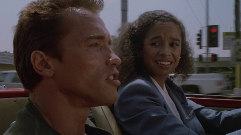 Arnold Schwarzenegger and Rae Dawn Chong in Commando 