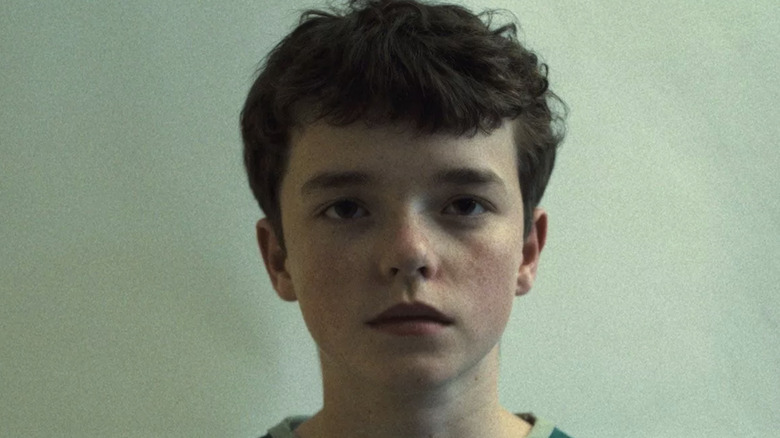 Owen Cooper as Jamie Miller staring blankly in Adolescence