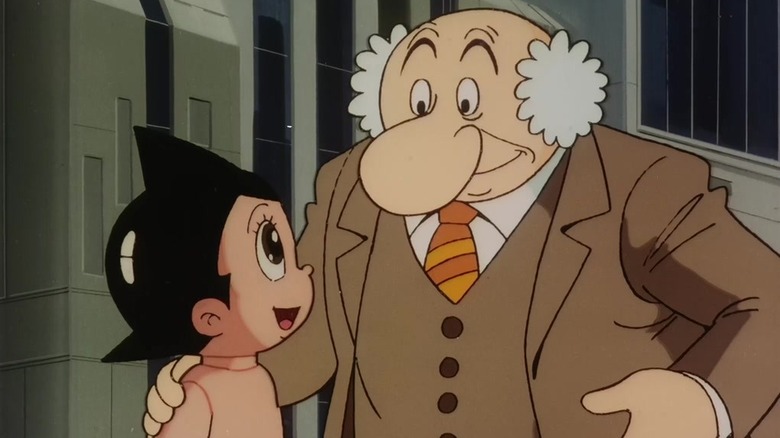 astro boy dr. ochanomizu pats atom's shoulder