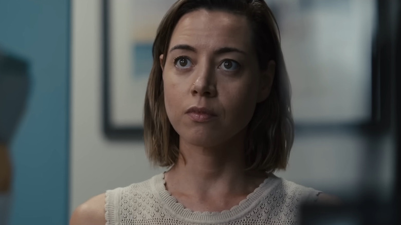 Aubrey Plaza in white shirt looking concerned in "Emily The Criminal"