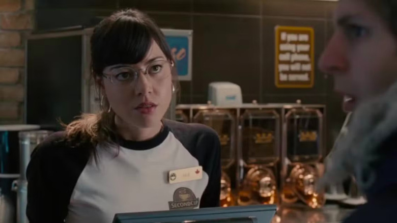 Aubrey Plaza working as a barista in front of Michael Cera in Scott Pilgrim vs. The World