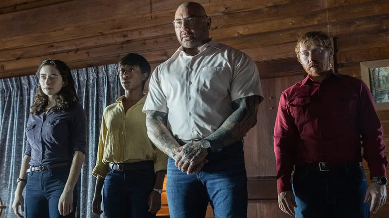 Dave Bautista, Rupert Grint, Nikki Amuka-Bird and Abby Quinn in Knock at the Cabin