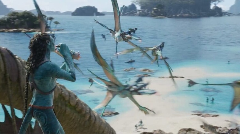 Avatar the way of water na'vi watching bird things fly over ocean