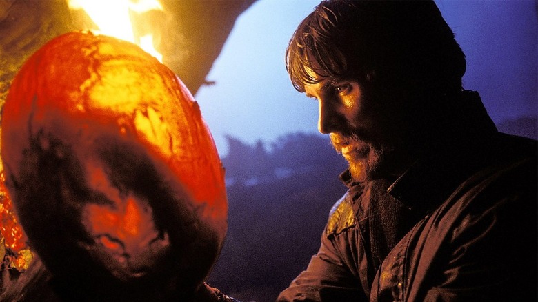 Christian Bale holds dragon egg