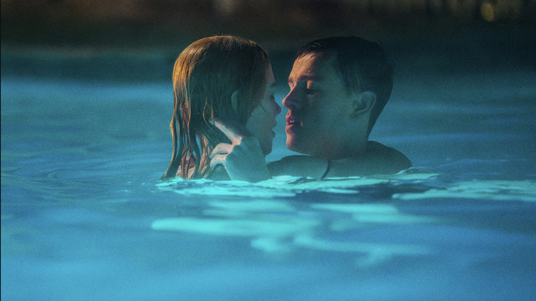 Romy and Samuel embrace in a pool in Babygirl