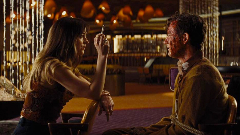 Dakota Johnson and Lewis Pullman in Bad Times at the El Royale