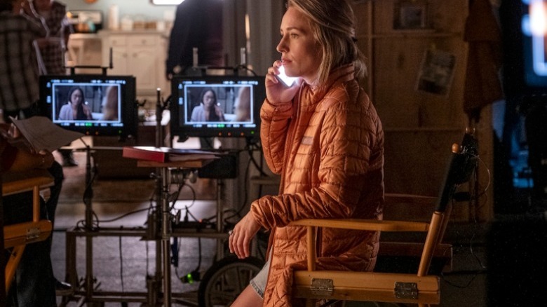 Sally on phone on set