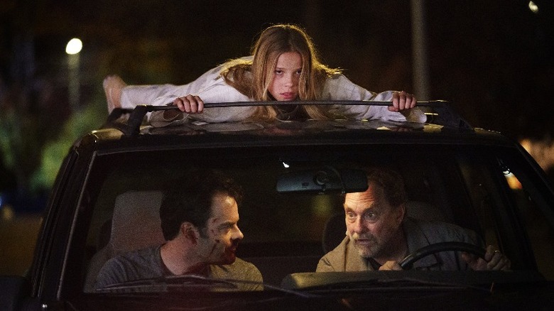 Girl atop Barry Fuches' car