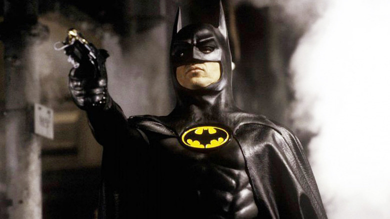 Michael Keaton wielding a Bat-Gadget in Batman