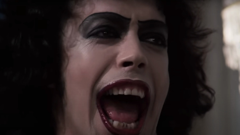 Tim Curry's Dr Frank-N-Furter sings with his mouth wide open in The Rocky Horror Picture Show