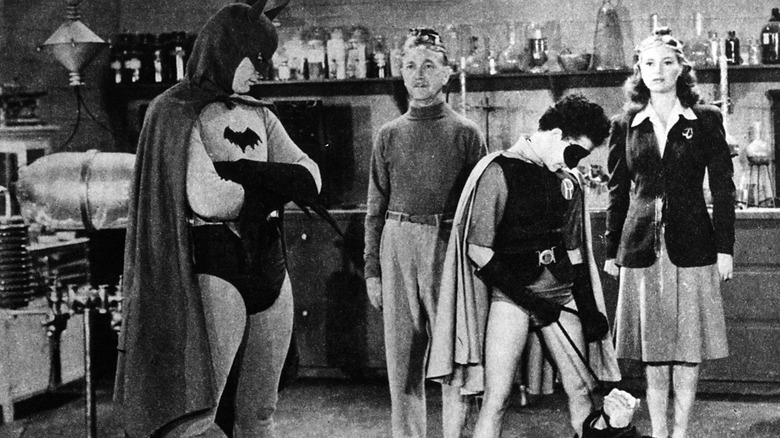 Batman and Robin capturing Dr. Daka with two mind-controlled pawns in the background in Batman (1943)