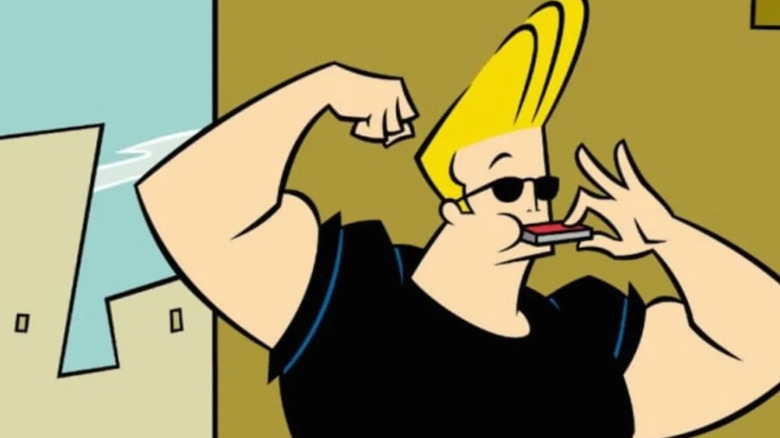 Johnny Bravo flexing his bicep and playing the harmonica.