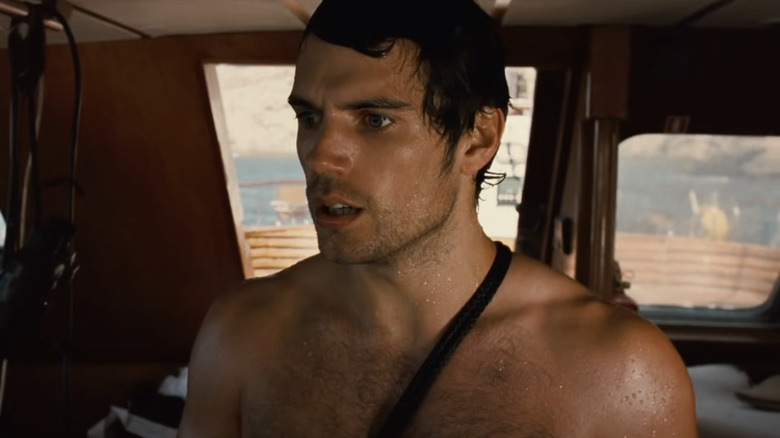 Will Shaw stands on the inside of his family's yacht looking concerned