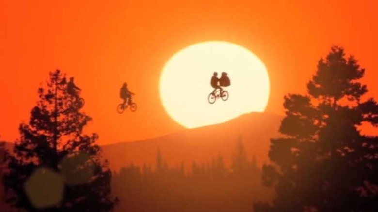 E.T. bikes flying against sunset