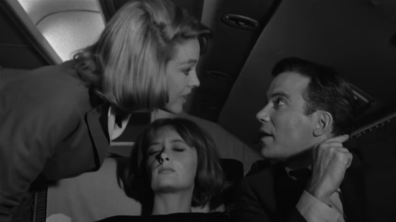 Robert Wilson talking to stewardess