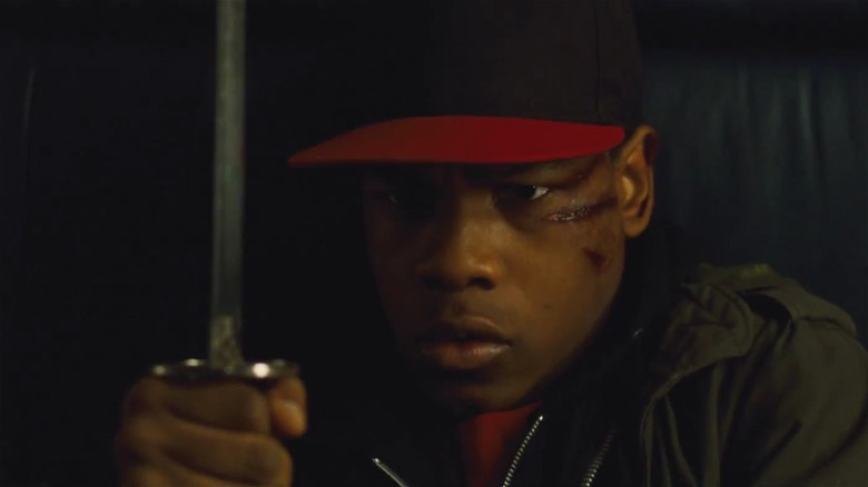 John Boyega holding a sword in Attack the Block