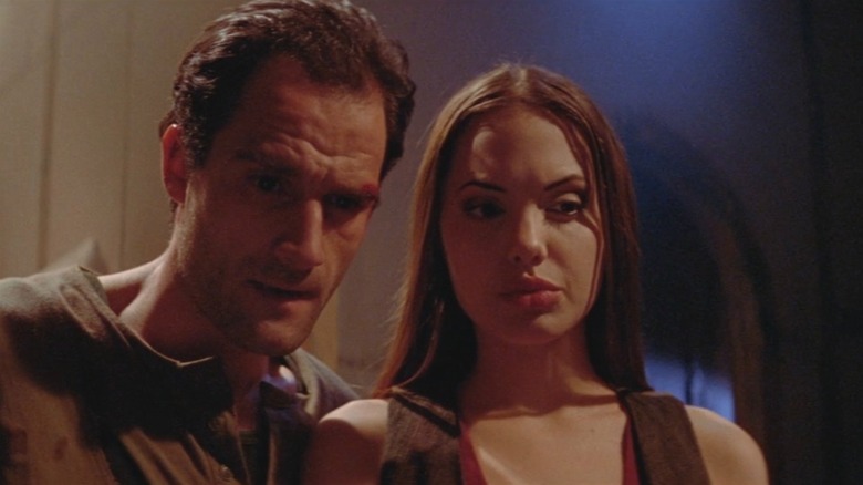 Angelina Jolie and Elias Koteas looking quizzical in Cyborg 2