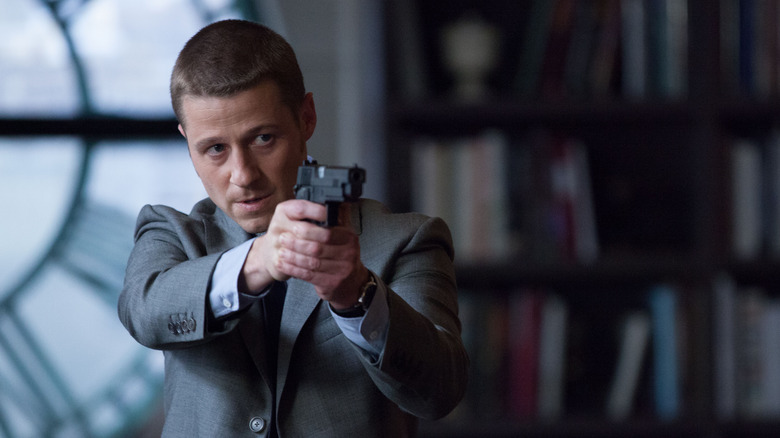 James Gordon with gun in Gotham